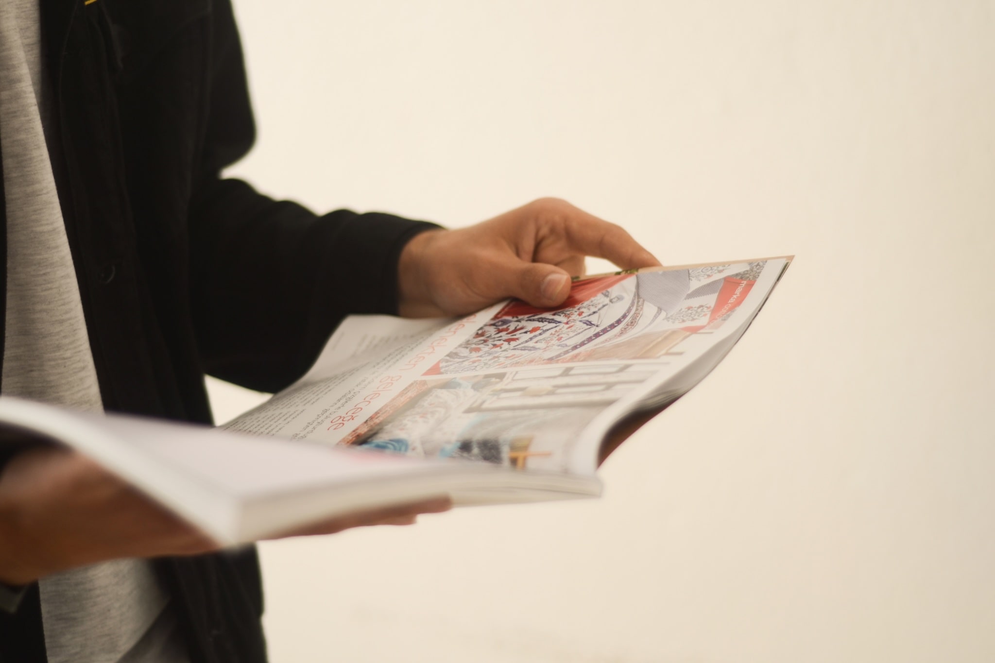 Man flipping through a print magazine