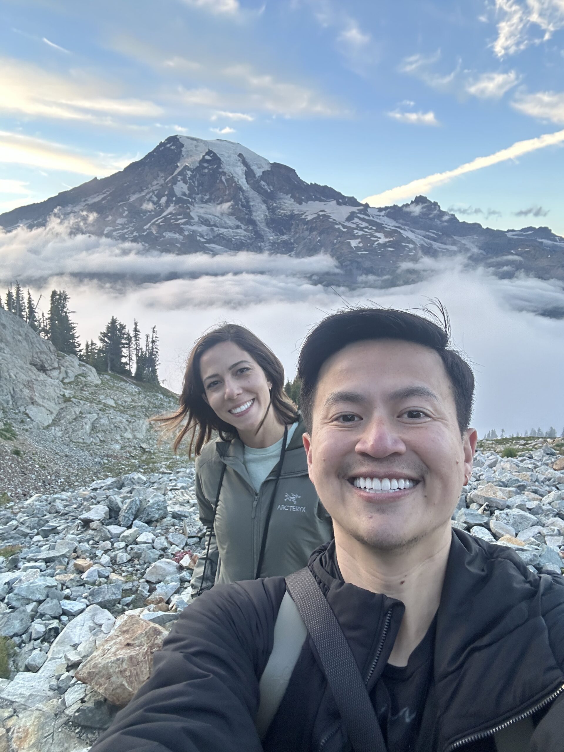 Washington elopement photographer and wedding blogger take a selfie on a mountain trail at Mt Rainier National Park. 